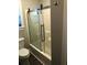 Bathroom features a shower-tub with glass doors, offering a practical and modern design at 1496 Cypress Pointe Dr, Mount Pleasant, SC 29466