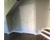 Bedroom features hardwood floors, a ceiling fan, and a double-door closet at 1496 Cypress Pointe Dr, Mount Pleasant, SC 29466