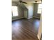 A roomy bedroom with wood floors and plenty of natural light at 1496 Cypress Pointe Dr, Mount Pleasant, SC 29466