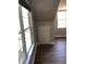A bright bedroom with two windows and wood floors at 1496 Cypress Pointe Dr, Mount Pleasant, SC 29466