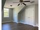 Neutral bedroom featuring modern ceiling fan, hardwood floors, a window, and double closets at 1496 Cypress Pointe Dr, Mount Pleasant, SC 29466