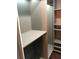 This is a view of a closet with built in shelving and hardwood floors at 1496 Cypress Pointe Dr, Mount Pleasant, SC 29466