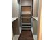 This is a view of a closet with built in shelving and hardwood floors at 1496 Cypress Pointe Dr, Mount Pleasant, SC 29466