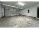 Spacious garage with a white door, concrete floors, and ample room for parking at 1496 Cypress Pointe Dr, Mount Pleasant, SC 29466