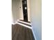 Hallway with hardwood floors and white trim at 1496 Cypress Pointe Dr, Mount Pleasant, SC 29466