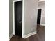 Hallway with hardwood flooring and a dark door at 1496 Cypress Pointe Dr, Mount Pleasant, SC 29466