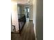 The upstairs hallway has hardwood floors and a view of the stairs at 1496 Cypress Pointe Dr, Mount Pleasant, SC 29466