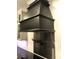 Stylish black range hood that adds a modern flair to your kitchen at 1496 Cypress Pointe Dr, Mount Pleasant, SC 29466