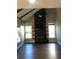 Living room with a fireplace and large windows, perfect for relaxing with lots of natural light at 1496 Cypress Pointe Dr, Mount Pleasant, SC 29466