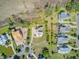 Aerial view of several homes in a residential neighborhood surrounded by trees, landscaping, and wetlands at 1500 Bower Ln, Johns Island, SC 29455
