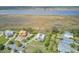 An aerial view showing waterfront real estate, marshy landscapes, and a clear view of the water at 1500 Bower Ln, Johns Island, SC 29455