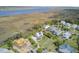 An overhead view showing waterfront real estate, marsh landscapes, and open waterway at 1500 Bower Ln, Johns Island, SC 29455