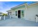 Exterior view of a home's balcony showcasing the building design and a partial view of a neighborhood at 1500 Bower Ln, Johns Island, SC 29455
