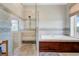 Luxurious bathroom featuring a glass-enclosed shower and separate soaking tub, designed for relaxation and comfort at 1500 Bower Ln, Johns Island, SC 29455