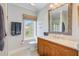Bathroom featuring a wood vanity, framed mirror, and a window with a view at 1500 Bower Ln, Johns Island, SC 29455