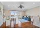 Bonus room featuring a ceiling fan, hardwood floors, a comfortable sofa and lovely views at 1500 Bower Ln, Johns Island, SC 29455
