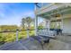 Expansive deck area featuring a swing and seating area offering panoramic views of lush greenery and open spaces at 1500 Bower Ln, Johns Island, SC 29455