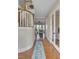 Inviting foyer featuring hardwood floors, coffered ceilings, a curved staircase, and an open view to the living room at 1500 Bower Ln, Johns Island, SC 29455