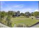 A front exterior view of a two-story home with a spacious lawn and beautifully landscaped grounds at 1500 Bower Ln, Johns Island, SC 29455