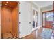 An inviting hallway with an elevator, beautiful wood floors and multiple doors for a connected interior at 1500 Bower Ln, Johns Island, SC 29455