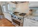 Modern kitchen with stainless steel range, granite countertops and white cabinetry at 1500 Bower Ln, Johns Island, SC 29455