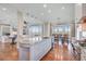 Open-concept kitchen features an island with bar seating, dining table and living room at 1500 Bower Ln, Johns Island, SC 29455