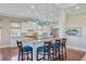 Modern kitchen with a large island, barstool seating, granite countertops, and stainless steel appliances at 1500 Bower Ln, Johns Island, SC 29455