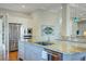 Gourmet kitchen featuring granite countertops, stainless steel appliances, and island with breakfast bar at 1500 Bower Ln, Johns Island, SC 29455