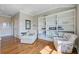 Cozy living space with hardwood floors, built-in shelves, and inviting seating at 1500 Bower Ln, Johns Island, SC 29455