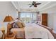 Spacious main bedroom with tray ceiling, wood floors, and large windows, providing a relaxing retreat at 1500 Bower Ln, Johns Island, SC 29455