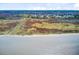 Expansive marshland view with waterway and distant community homes against a clear blue sky at 1500 Bower Ln, Johns Island, SC 29455