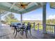 Relaxing covered porch with a comfortable swing seating area that provides an excellent view of the surrounding scenery at 1500 Bower Ln, Johns Island, SC 29455