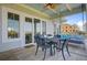 Charming covered porch with a swing seating area and exterior views, providing a cozy spot to unwind outdoors at 1500 Bower Ln, Johns Island, SC 29455