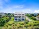 Striking rear exterior showcasing a two-story home with a pristine lawn and fenced yard in a tranquil setting at 1500 Bower Ln, Johns Island, SC 29455