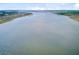 Beautiful aerial view of a wide river and natural shoreline, perfect for boating and recreation at 1500 Bower Ln, Johns Island, SC 29455