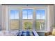 Bedroom view from a large window overlooking tranquil scenery with water and trees at 1500 Bower Ln, Johns Island, SC 29455