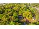 Aerial view of a secluded home surrounded by mature trees and lush greenery at 1518 Southwick Dr, Johns Island, SC 29455