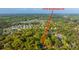 Aerial view of the home surrounded by lush trees within a neighborhood with surrounding amenities at 1518 Southwick Dr, Johns Island, SC 29455
