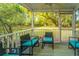 Inviting screened porch with comfortable seating and a view of the lush backyard at 1518 Southwick Dr, Johns Island, SC 29455