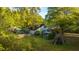 An expansive backyard with mature trees and lush landscaping, showcasing a serene outdoor space at 1518 Southwick Dr, Johns Island, SC 29455