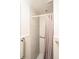 Accessible bathroom features neutral tile, safety bars, and a shower curtain at 1518 Southwick Dr, Johns Island, SC 29455