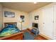 Cozy bedroom with colorful wall art, wood floors, and a storage closet at 1518 Southwick Dr, Johns Island, SC 29455