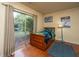Cozy bedroom featuring a sliding glass door, wood floors, and personal wall decor at 1518 Southwick Dr, Johns Island, SC 29455