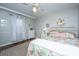 Cozy bedroom features a flamingo floral-patterned bedspread and a white ceiling fan for added comfort at 1518 Southwick Dr, Johns Island, SC 29455