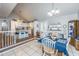 Charming dining area and kitchen offer a cozy atmosphere with white cabinets and blue accents at 1518 Southwick Dr, Johns Island, SC 29455