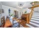 Inviting dining room features a wooden table, piano, and staircase, creating a warm and elegant atmosphere at 1518 Southwick Dr, Johns Island, SC 29455