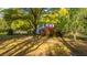Two-story home with mature trees, azaleas, and a landscaped yard at 1518 Southwick Dr, Johns Island, SC 29455