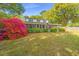 Charming two-story home with a landscaped yard, screened porch and beautiful blooming azaleas at 1518 Southwick Dr, Johns Island, SC 29455