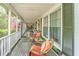 Inviting covered porch with comfortable seating and charming curb appeal at 1518 Southwick Dr, Johns Island, SC 29455