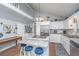Bright kitchen and dining area feature white cabinets, stainless steel appliances, and a vaulted ceiling at 1518 Southwick Dr, Johns Island, SC 29455